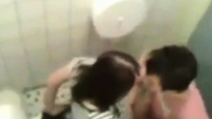 College couple caught fucking in the restrooms